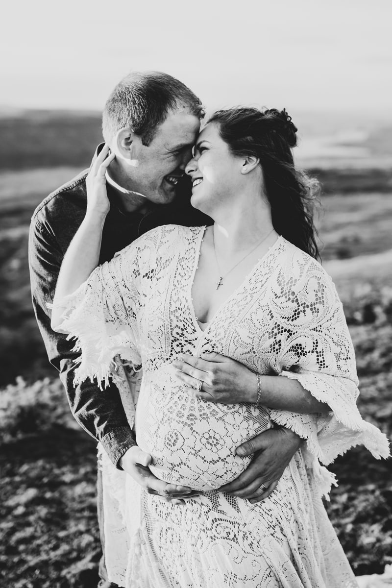 Seattle Maternity Photography, a couple hold each other fondly, they are happy, she is pregnant
